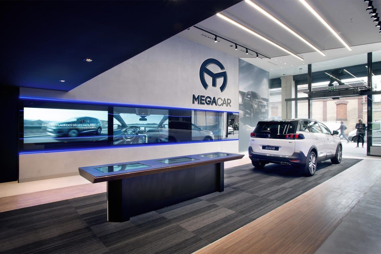 Megacar showroom with the brand on the wall