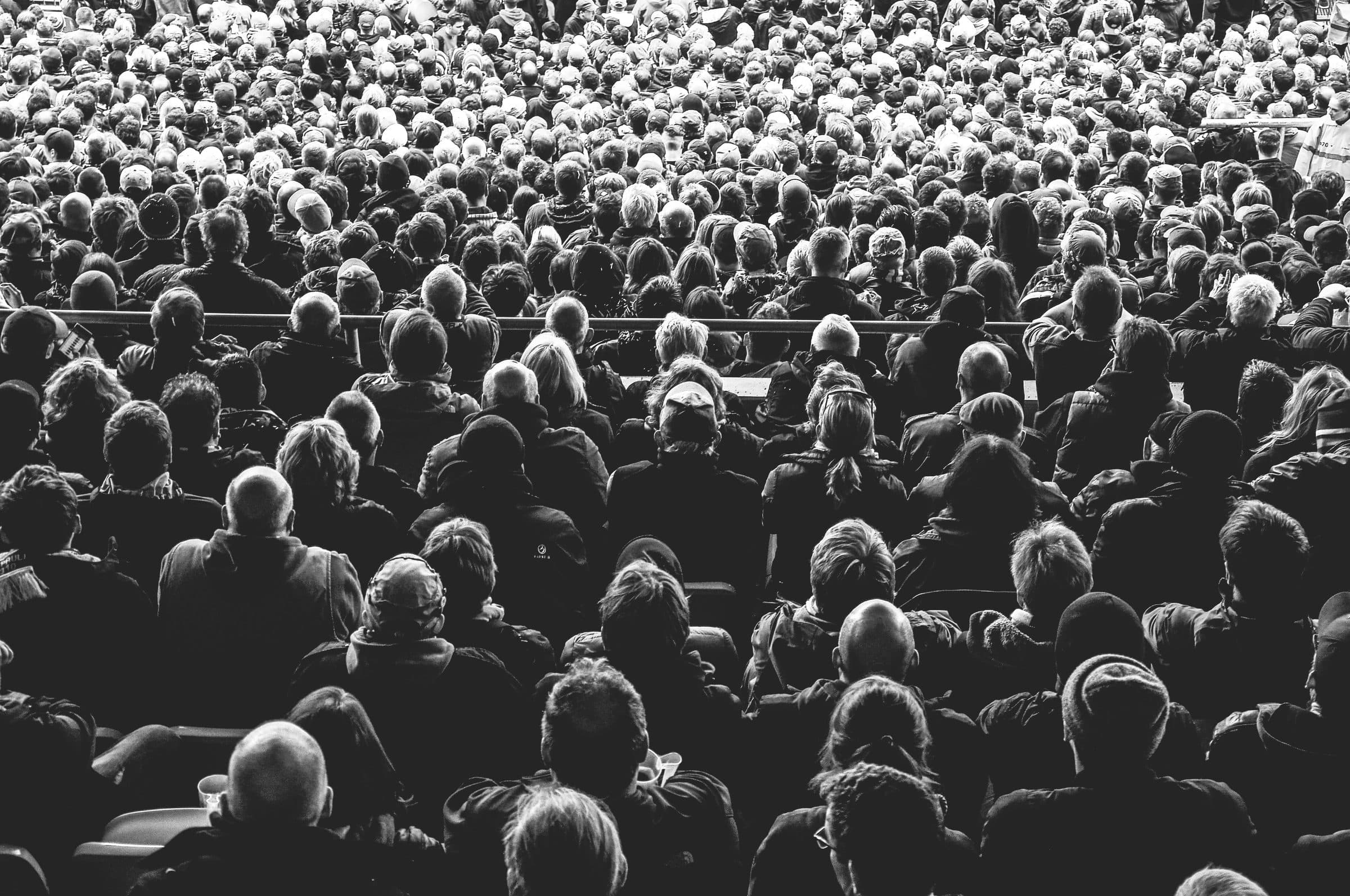Black and white crowd in a stadium